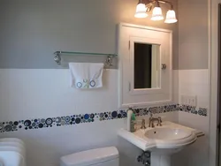 Bathroom design with wall painting and tiles photo design