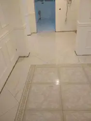 Tiles on the floor in the kitchen and hallway photo in the apartment