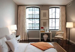 Small bedroom design with two windows