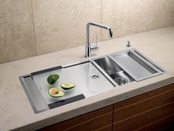 Sink built into the countertop for the kitchen photo
