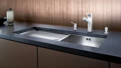 Sink built into the countertop for the kitchen photo