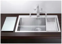 Sink built into the countertop for the kitchen photo