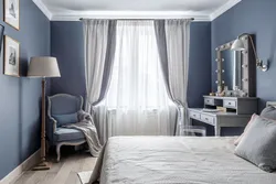 Gray curtains in the bedroom interior