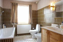 Design of a bathroom with a toilet in the house with a window