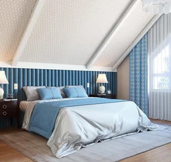 Bedroom interior in a house with a sloping ceiling