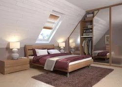 Bedroom interior in a house with a sloping ceiling