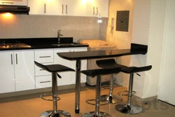 Kitchen interior with a bar counter in a small kitchen design photo