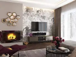 Qonaq otağının içərisində şömine və televizor olan divar