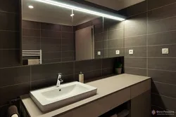 Bath with brown furniture photo