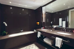 Bath with brown furniture photo