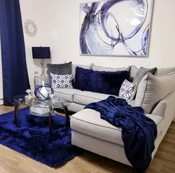 Curtains in the interior of the living room with a blue sofa photo