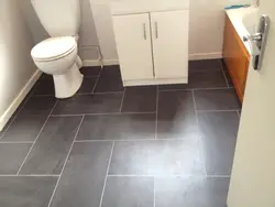 Tiles for bathroom floor in apartment photo