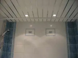 Spotlight in a plastic ceiling in the bathroom photo