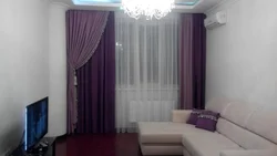 Purple curtains in the living room interior