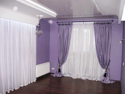 Purple curtains in the living room interior