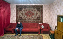 Carpet on the wall in the living room interior