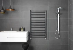 Heated towel rail in the bathroom photo