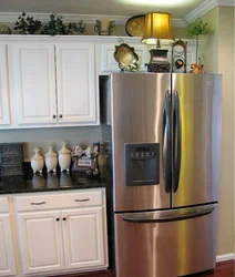 Kitchen with gold refrigerator photo