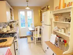 Kitchen with gold refrigerator photo