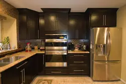 Kitchen with gold refrigerator photo