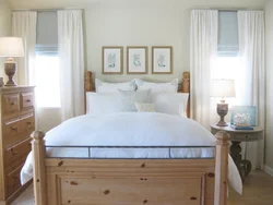 Wooden bed in the bedroom interior photo