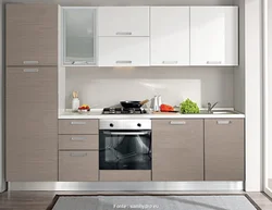 Photo of a linear kitchen with a refrigerator