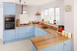 Photo of a kitchen with a wood-colored countertop