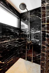 Black marble tiles in the bathroom photo design