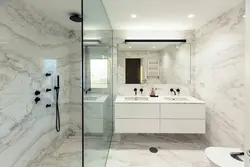 Black marble tiles in the bathroom photo design