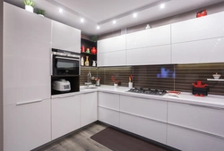 Kitchen interior with white glossy furniture