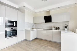 Kitchen interior with white glossy furniture