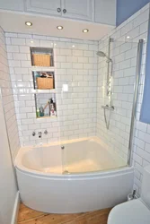 Corner bathtub in a small bathroom photo