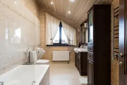 Design of a bath with toilet in a wooden house photo