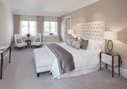 Beige bed in a gray bedroom photo