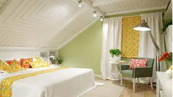Bedroom in the attic with a sloping ceiling photo