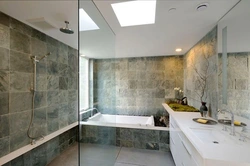 Bath with toilet in gray photo