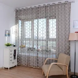 Design of curtains for living rooms in an apartment with a balcony