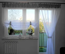 Photo of a curtain for the kitchen with a balcony door