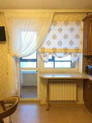 Photo of a curtain for the kitchen with a balcony door