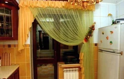 Photo of a curtain for the kitchen with a balcony door