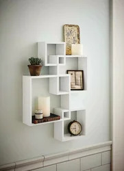 Modern shelves on the wall in the bedroom photo