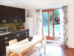 Interior of a kitchen with a balcony door