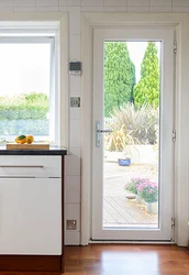 Interior of a kitchen with a balcony door