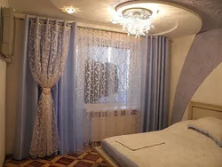 Stylish curtains in the bedroom interior