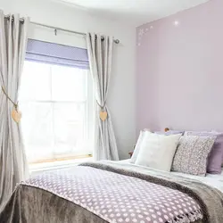 Curtains in the interior of a small bedroom photo