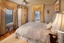 Curtains in the interior of a small bedroom photo