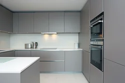 White-gray corner kitchen in the interior