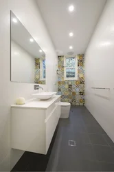 Narrow long bathtub with toilet design