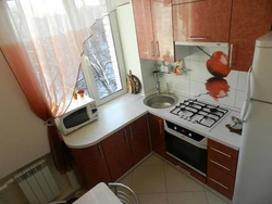 Kitchen 5 Meters Design Photo With Geyser And Refrigerator