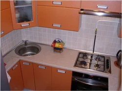 Kitchen 5 meters design photo with geyser and refrigerator